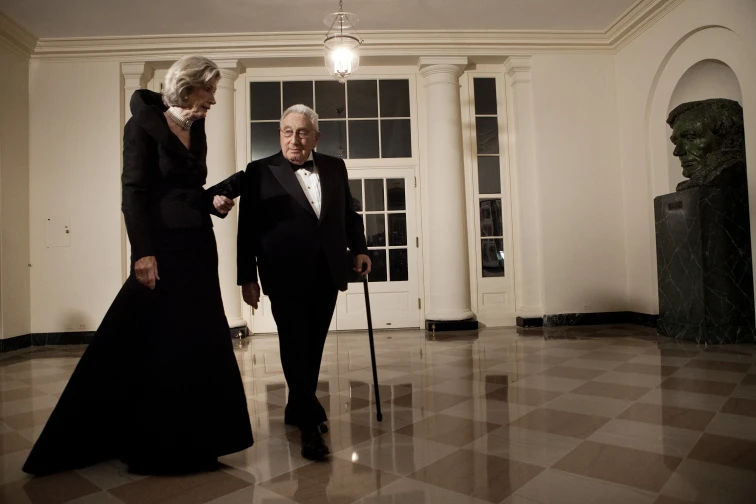 Nancy Kissinger and husband Henry Kissinger arrive at the White House for a state dinner in 2011.