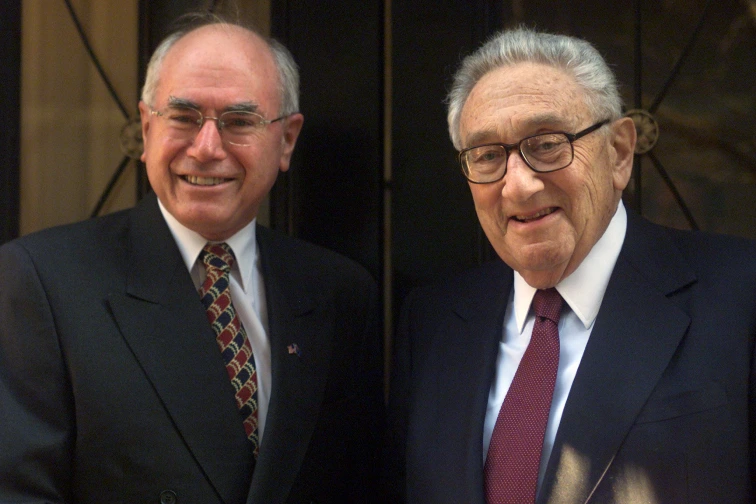 John Howard, then prime minister of Australia, with Henry Kissinger in New York in 2002