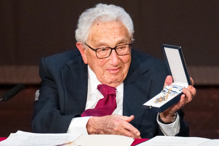 Henry Kissinger, former US secretary of state, holds the Bavarian Order of Maximilian during celebrations marking his 100th birthday.