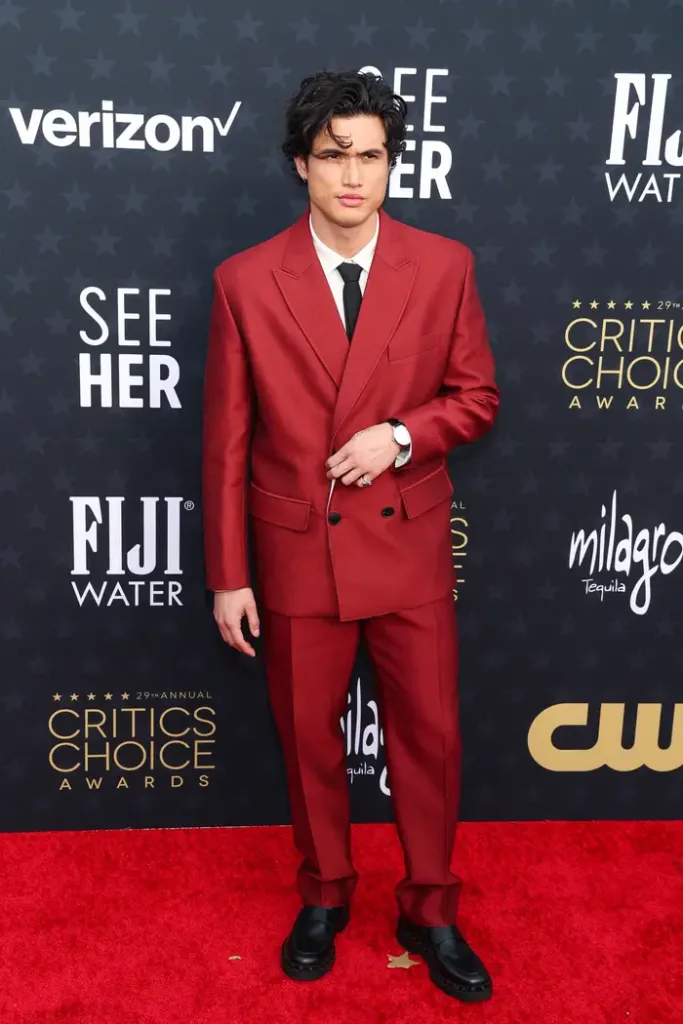 Charles Melton wore a red suit by Valentino