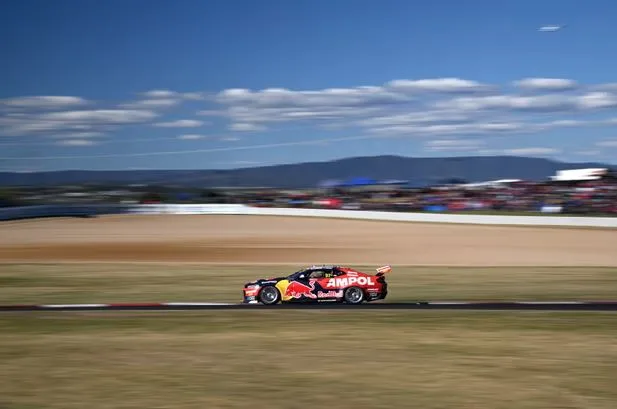 Shane van Gisbergen drives the Red Bull Ampol Racing Chevrolet Camaro ZL1 in at Mount Panorama in New South Wales. Photograph Dan HimbrechtsAAP