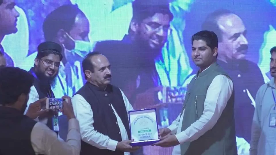 MPA Muhammad Ashraf Khan Rind gives an award to the principal of Star College.