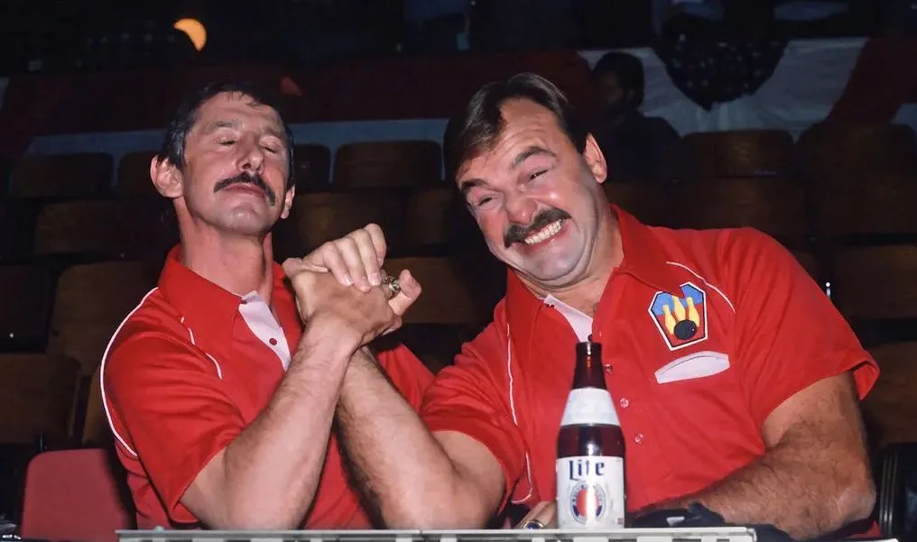 Butkus, right, recorded a Miller Lite commercial with Yankees manager Billy Martin in 1981. Butkus pursued acting after football, appearing in films, TV, and advertisements. Credit... Yvonne Hemsey/Getty