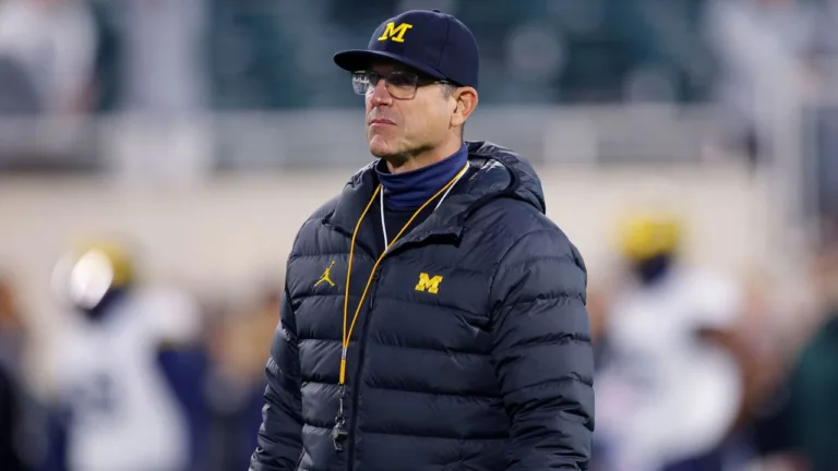 The Big Ten bans Michigan’s Jim Harbaugh from the sidelines