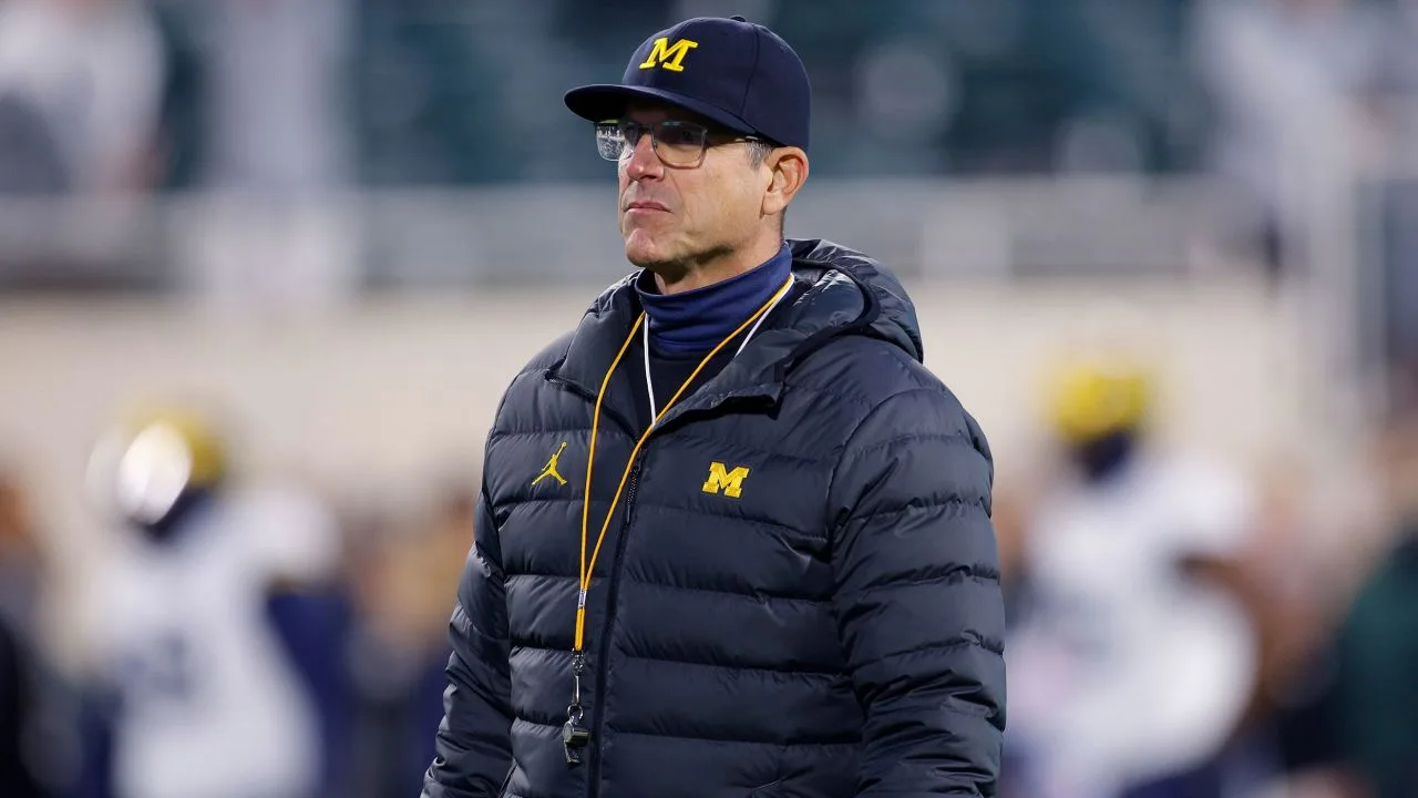 The Big Ten bans Michigan's Jim Harbaugh from the sidelines