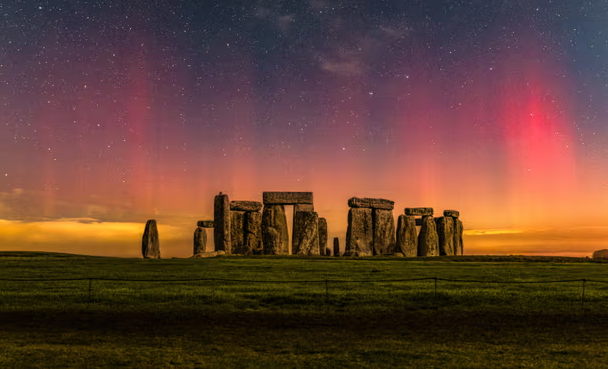 The northern lights over Stonehenge in Wiltshire on Saturday evening. This image consists of two photos, a 16-second exposure of the sky and a two-minute exposure of the foreground, merged together. Photograph: Nick Bull/pictureexclusive.com