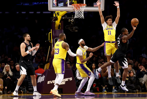 The Lakers beat the Clippers 130-125 in overtime to stop an 11-game losing streak.